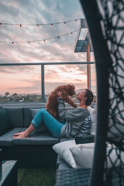 Woman holds her Goldendoodle.