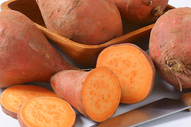 Sweet potatoes on a white background.